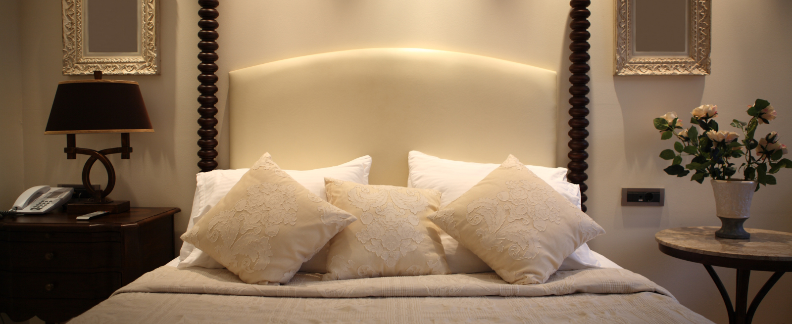 Hotel bed with fluffy pillows serene lighting